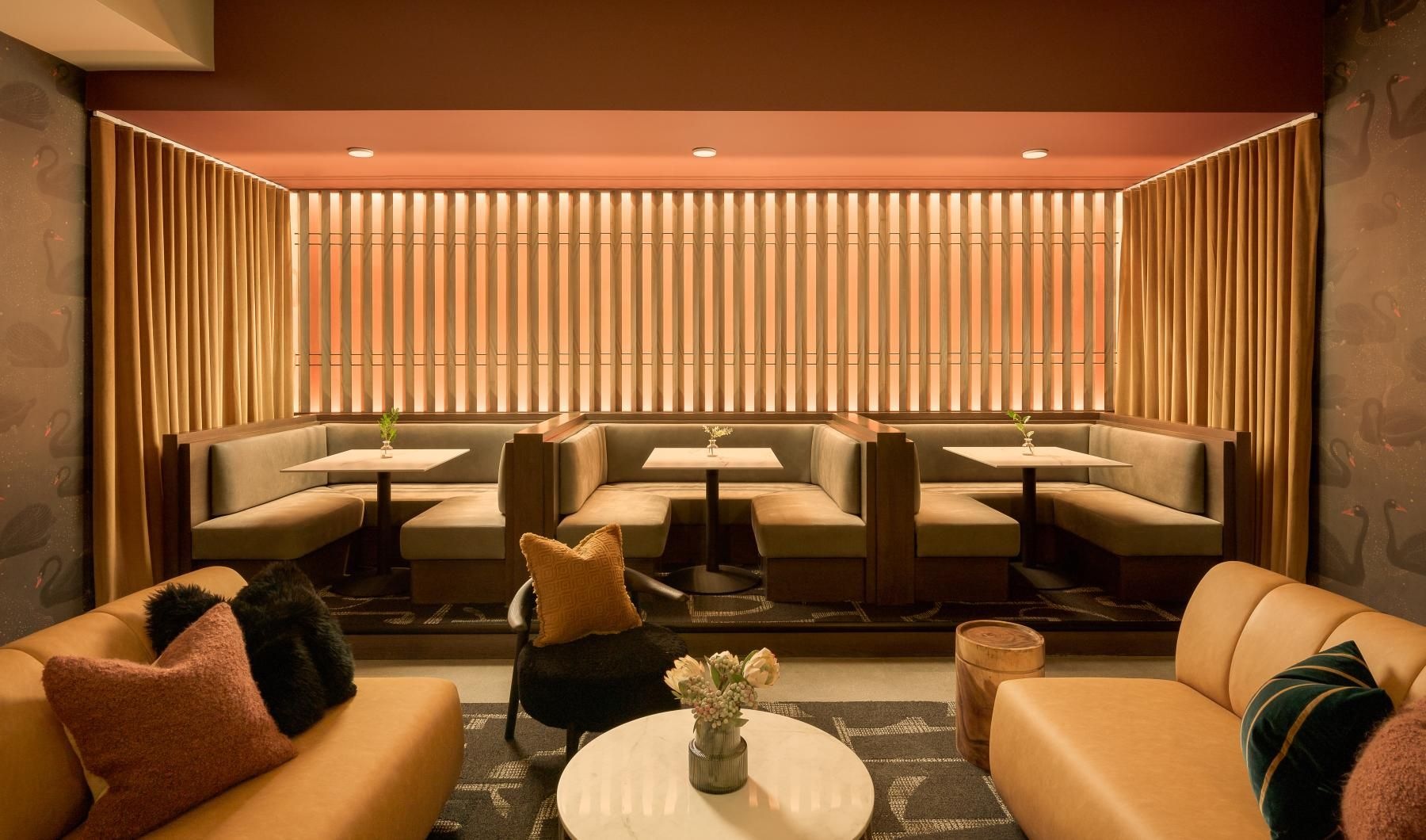 a room with a couch and chairs