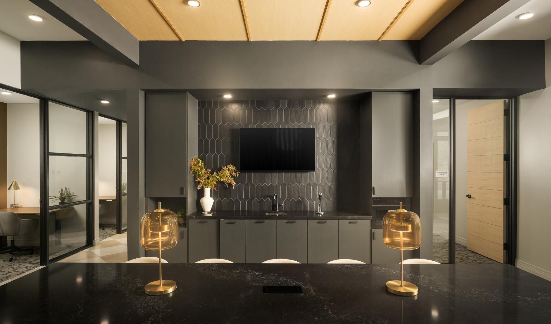 a kitchen with a large black counter